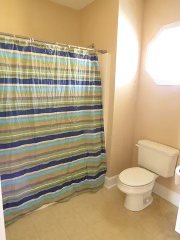 a bathroom with a toilet and a sink