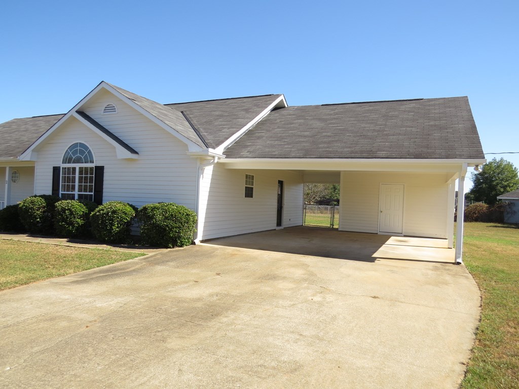 2 Whippoorwill Lane Fort Mitchell, AL 36856 - Photo 2 of 27 a front view of a house with a yard and garage