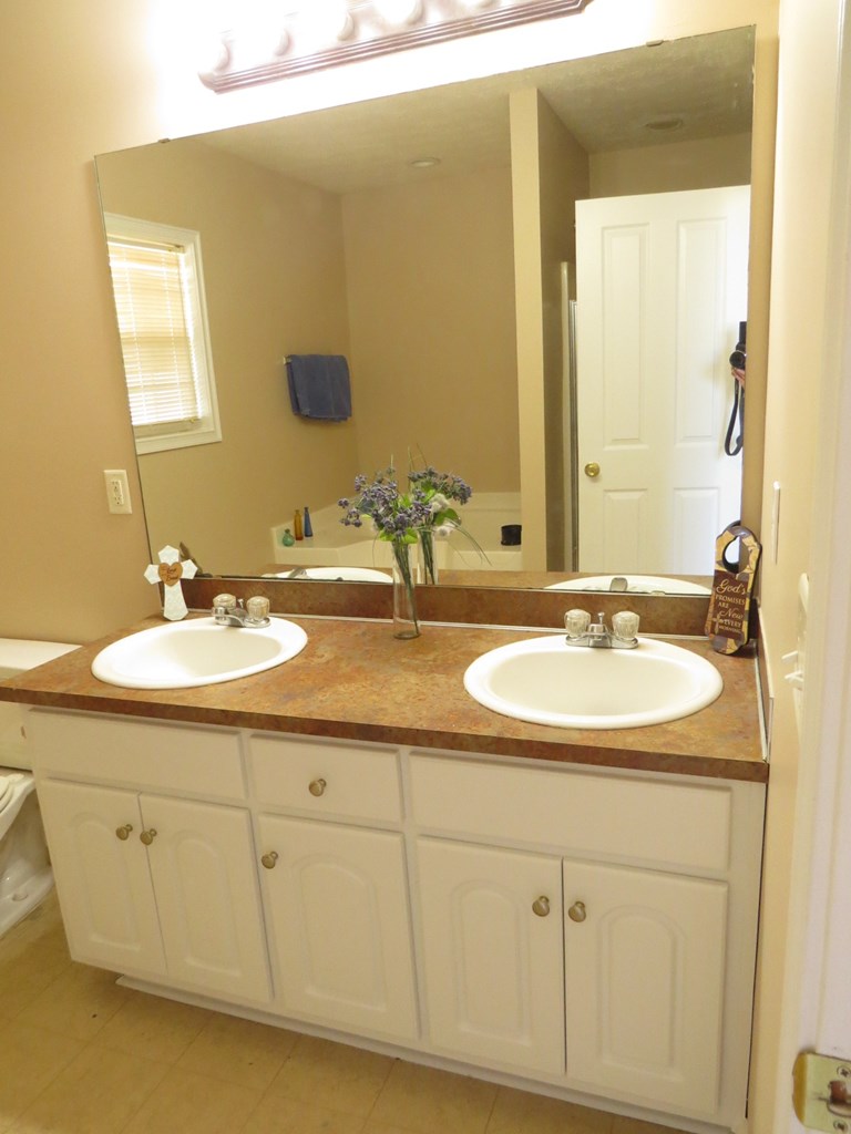2 Whippoorwill Lane Fort Mitchell, AL 36856 - Photo 24 of 27 a bathroom with a sink and a mirror