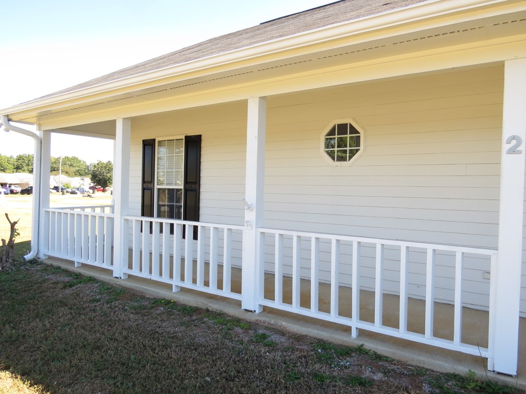 2 Whippoorwill Lane Fort Mitchell, AL 36856 - Photo 3 of 27 a view of a door with a small yard