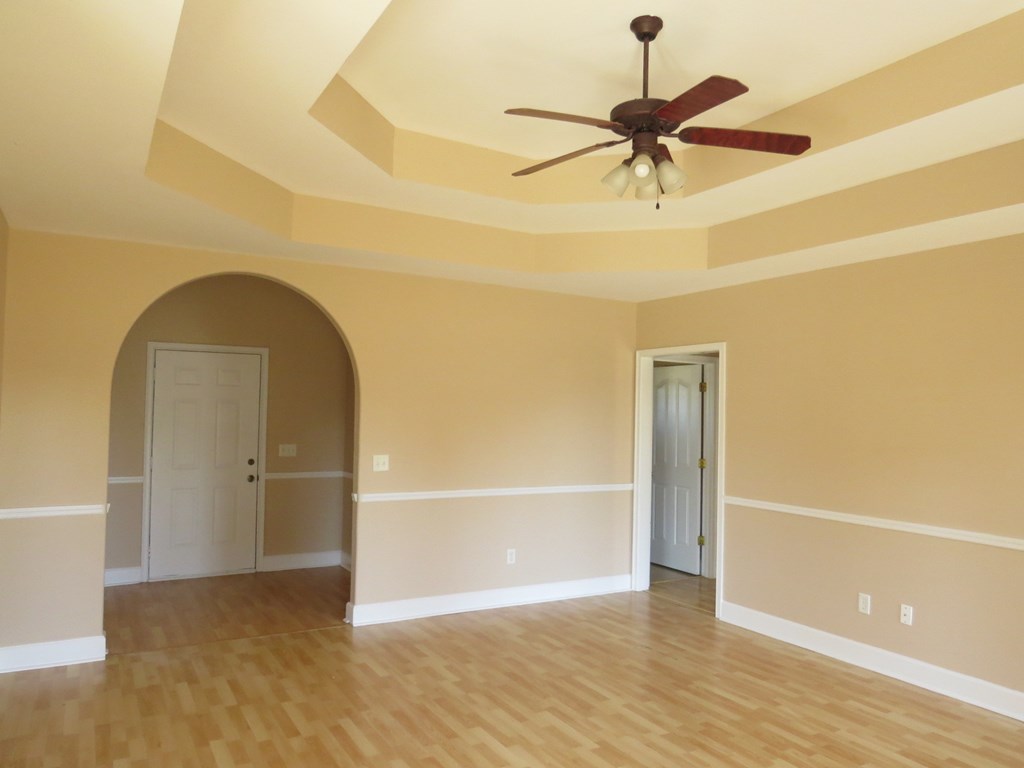 2 Whippoorwill Lane Fort Mitchell, AL 36856 - Photo 6 of 27 a view of empty room with wooden floor and ceiling fan