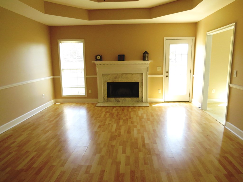 2 Whippoorwill Lane Fort Mitchell, AL 36856 - Photo 7 of 27 a room with a fireplace and wooden floor