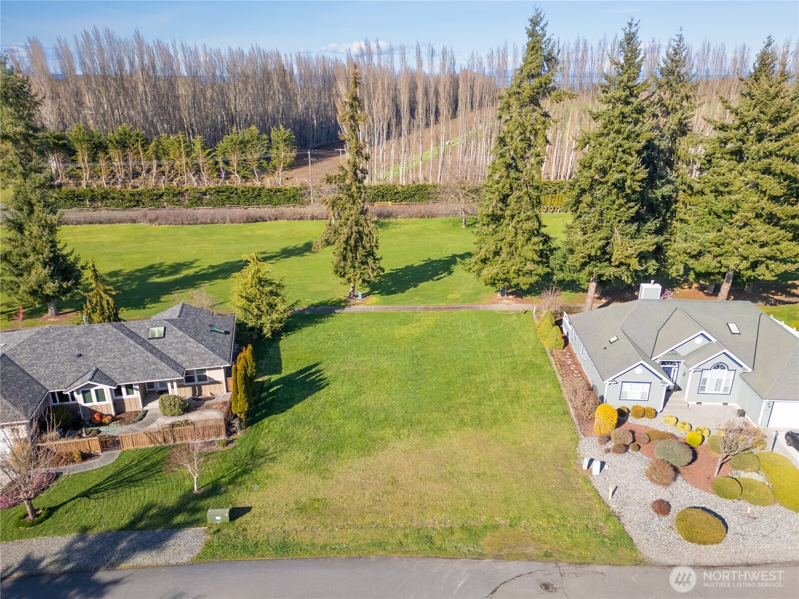 9999 Hurricane Ridge Drive Sequim, WA 98382 - Photo 4 of 12 a view of a swimming pool with an outdoor space and seating area