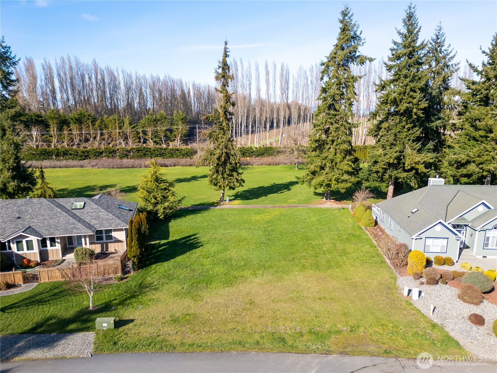 9999 Hurricane Ridge Drive Sequim, WA 98382 - Photo 5 of 12 an aerial view of a house with garden space and trees