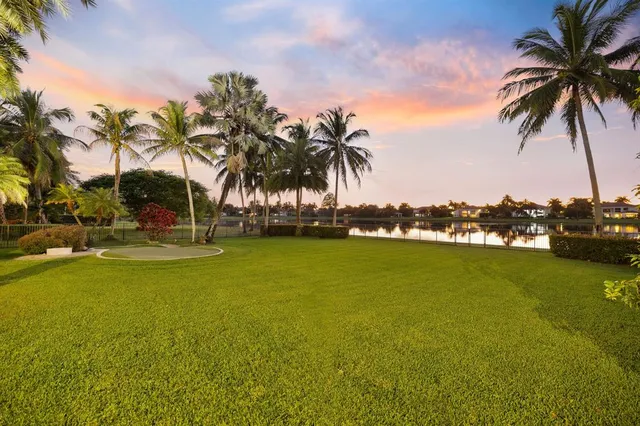 a kitchen with stainless steel appliances granite countertop a refrigerator a sink and a stove