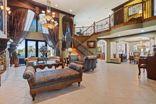 a kitchen with stainless steel appliances granite countertop a sink and a refrigerator