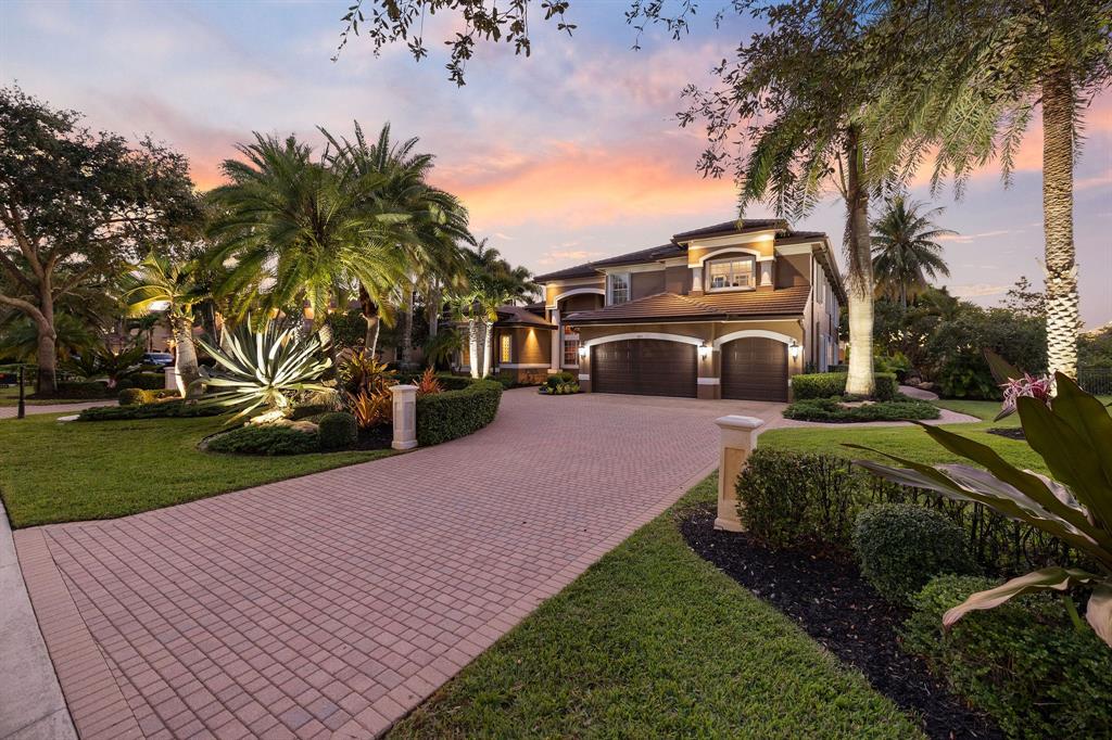 3413 Dovecote Meadow Lane Davie, FL 33328 - Photo 2 of 68 a front view of a house with a yard