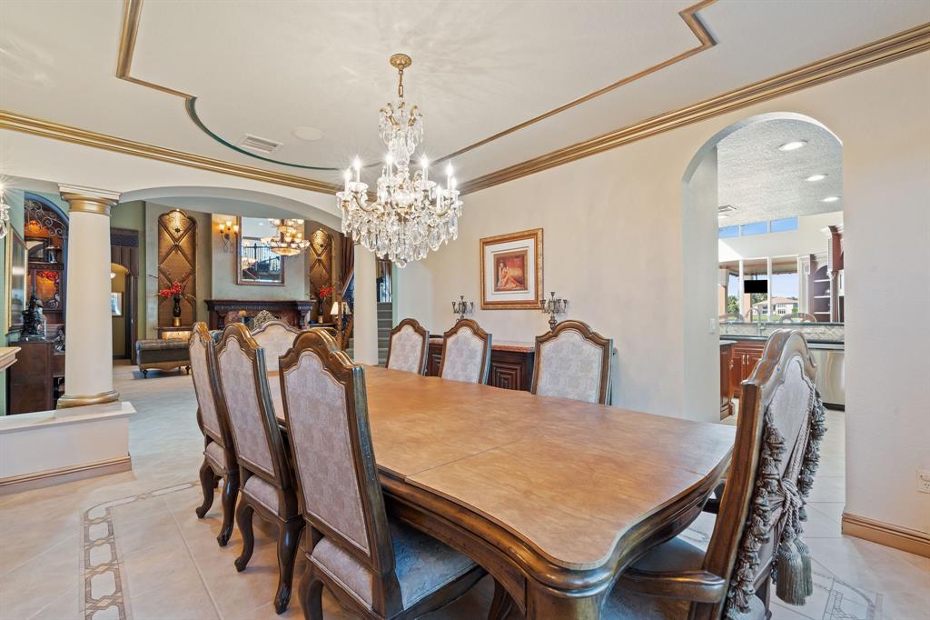 3413 Dovecote Meadow Lane Davie, FL 33328 - Photo 21 of 68 a view of a dining room with furniture and chandelier