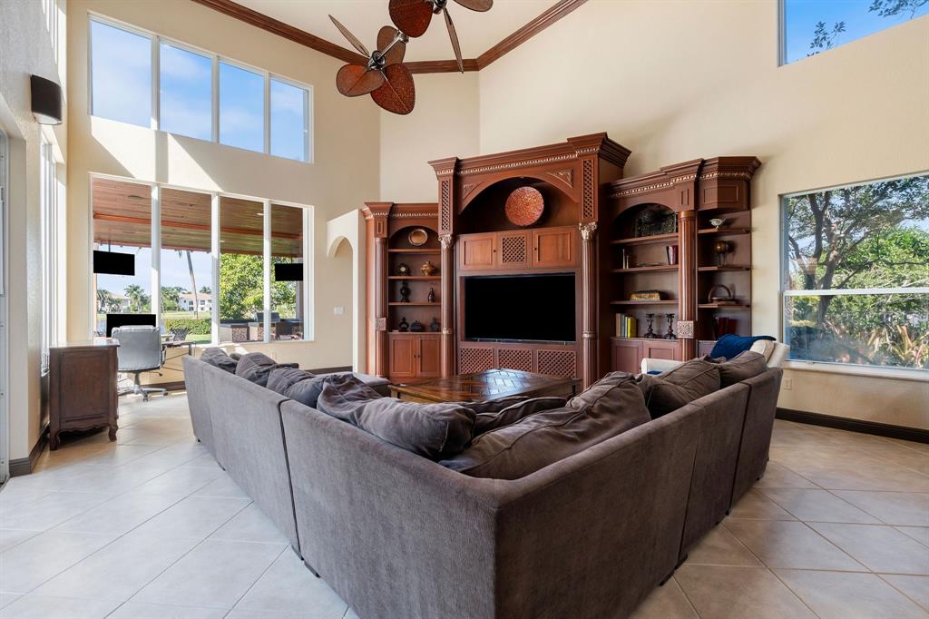 3413 Dovecote Meadow Lane Davie, FL 33328 - Photo 23 of 68 a living room with fireplace furniture and a large window