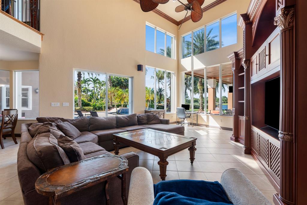 3413 Dovecote Meadow Lane Davie, FL 33328 - Photo 24 of 68 a living room with furniture fireplace and a large window