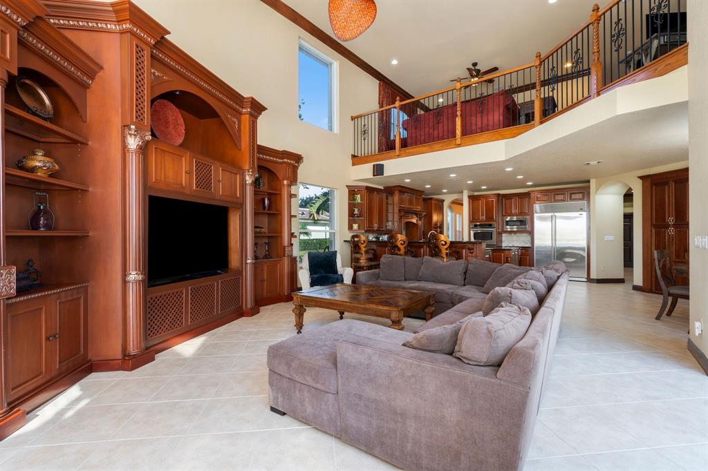 3413 Dovecote Meadow Lane Davie, FL 33328 - Photo 25 of 68 a living room with furniture and a flat screen tv