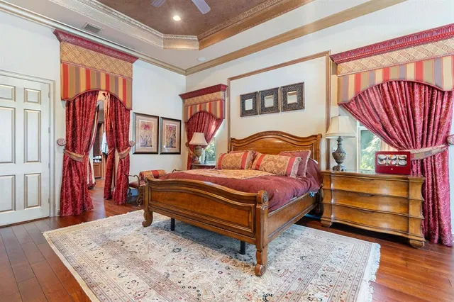 a living room with furniture a ceiling fan and a rug