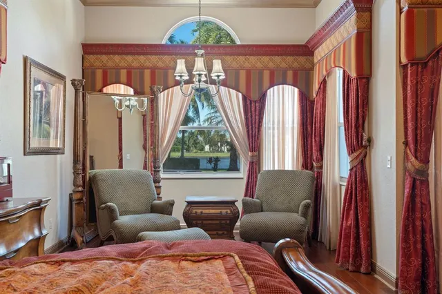 a living room with furniture kitchen view and a window
