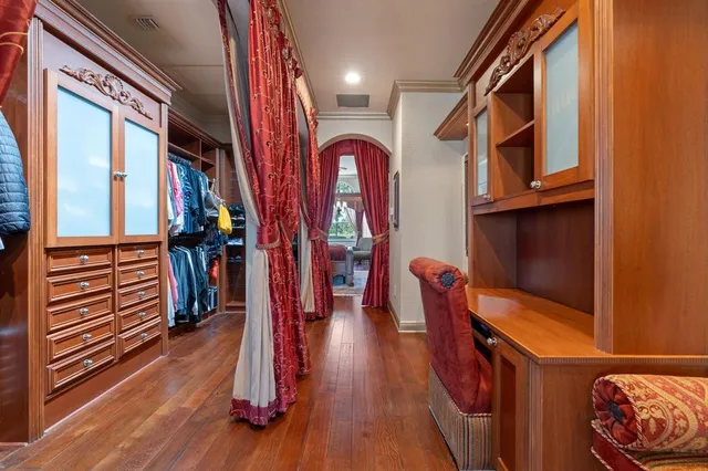 a bedroom with furniture and a baby crib