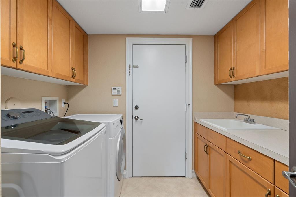 3413 Dovecote Meadow Lane Davie, FL 33328 - Photo 38 of 68 a kitchen with a sink and cabinets