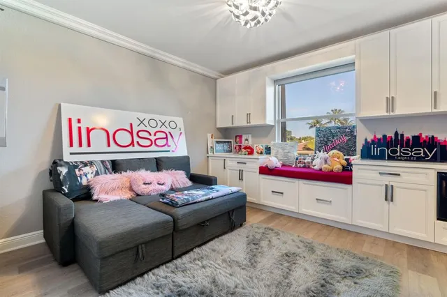 a row of palm trees and swimming pool in the patio of a swimming pool