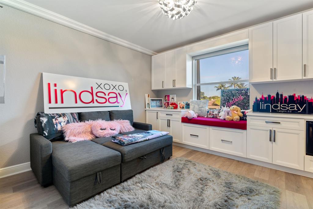 3413 Dovecote Meadow Lane Davie, FL 33328 - Photo 42 of 68 a bedroom with furniture and a baby crib