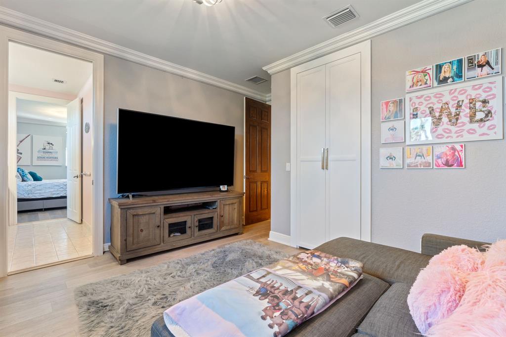 3413 Dovecote Meadow Lane Davie, FL 33328 - Photo 43 of 68 a bedroom with a bed and a flat screen tv