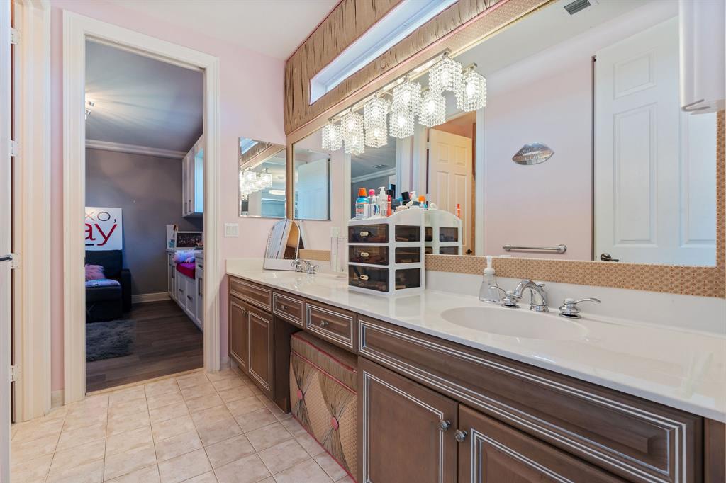 3413 Dovecote Meadow Lane Davie, FL 33328 - Photo 44 of 68 a spacious bathroom with a sink and a mirror