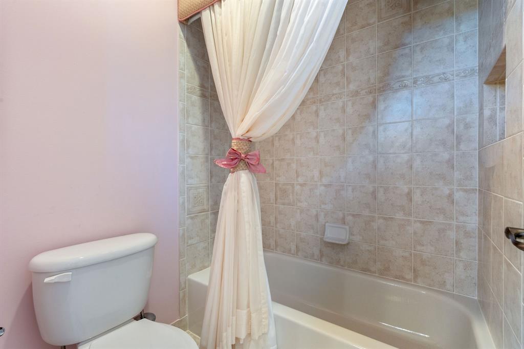 3413 Dovecote Meadow Lane Davie, FL 33328 - Photo 45 of 68 a white toilet sitting next to a bath tub