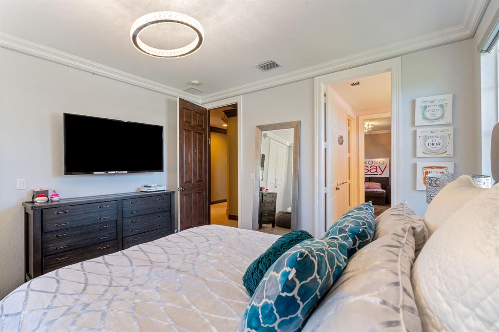 3413 Dovecote Meadow Lane Davie, FL 33328 - Photo 47 of 68 a bedroom with a bed and a flat screen tv