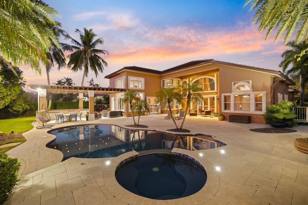 3413 Dovecote Meadow Lane Davie, FL 33328 - Photo 7 of 68 a view of a swimming pool with outdoor seating