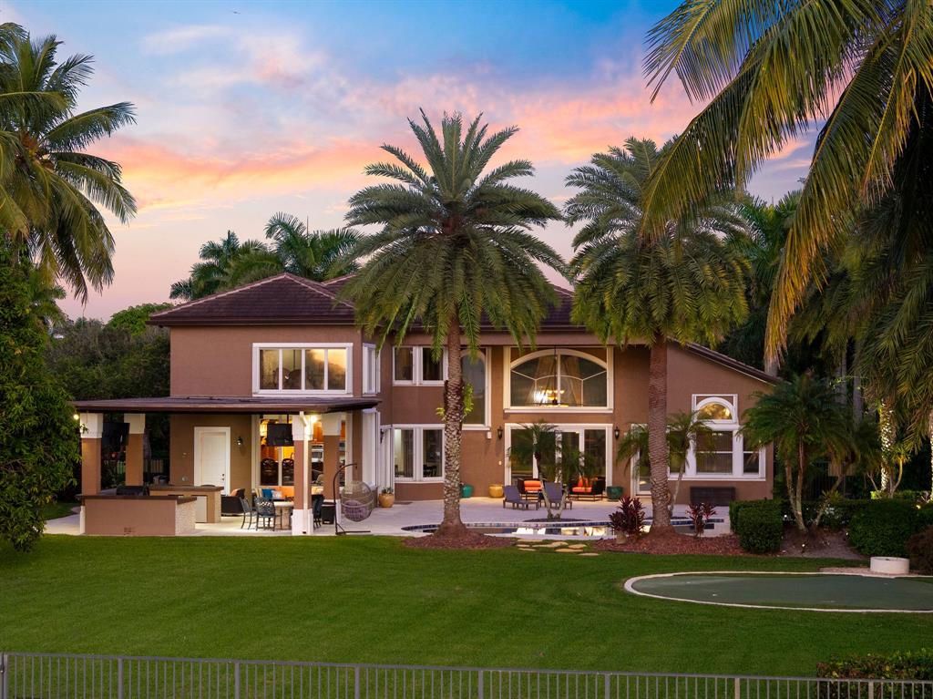 3413 Dovecote Meadow Lane Davie, FL 33328 - Photo 8 of 68 a front view of a house with swimming pool having outdoor seating