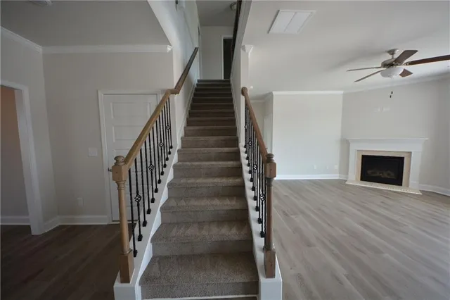a view of a hallway view with staircase