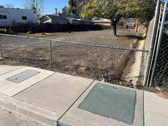 a view of a back yard of the car parked