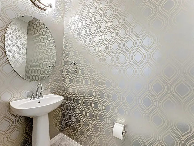 a bathroom with a sink and mirror