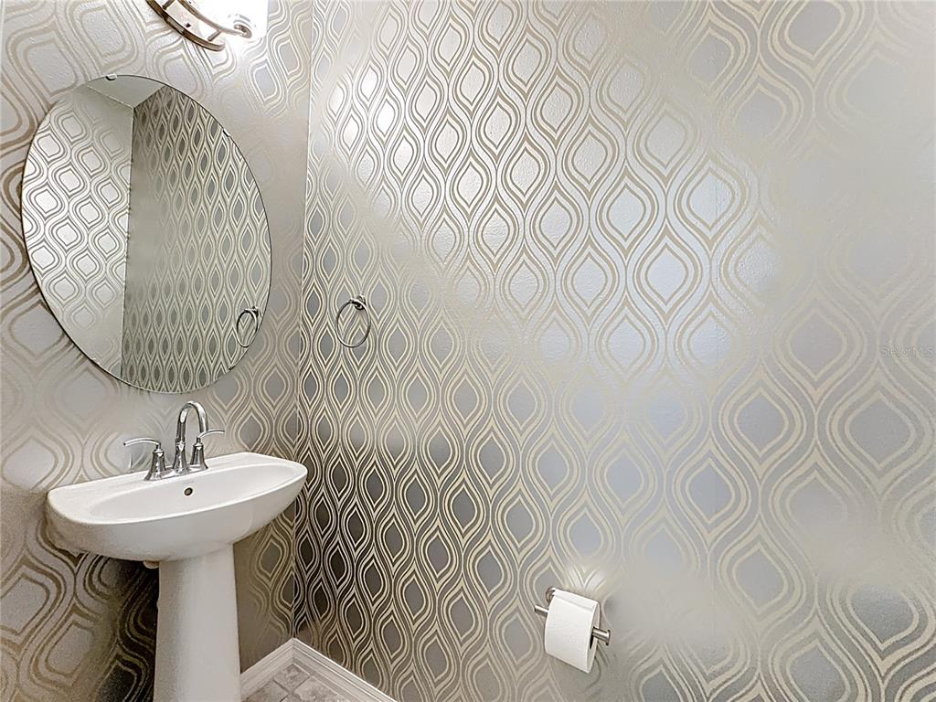 11209 Grander Drive Windermere, FL 34786 - Photo 14 of 35 a bathroom with a sink and mirror