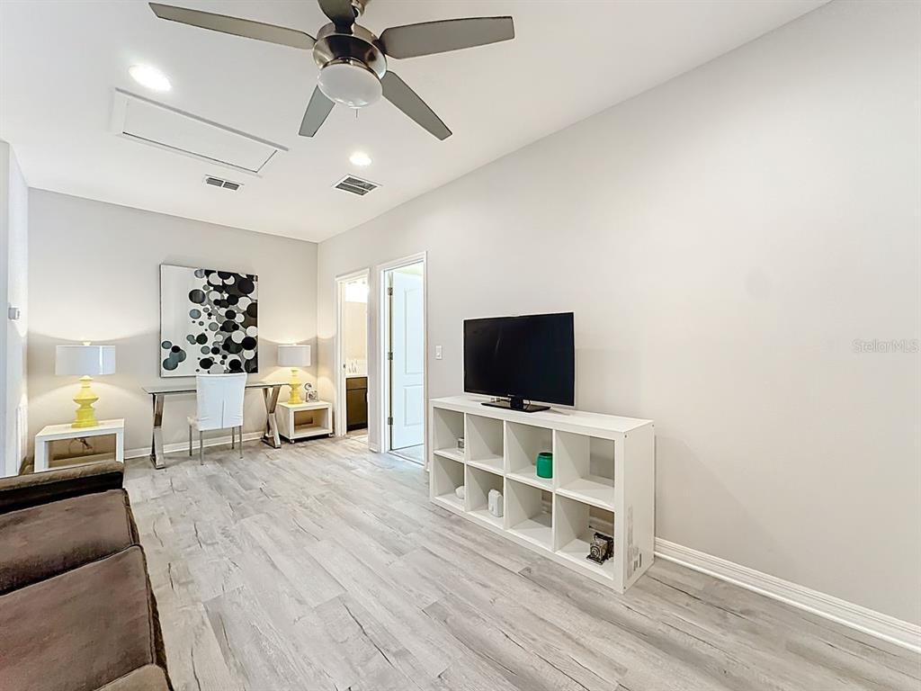 11209 Grander Drive Windermere, FL 34786 - Photo 24 of 35 a view of a livingroom with a flat screen tv