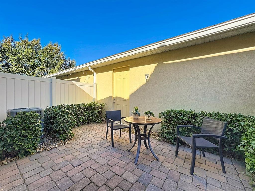11209 Grander Drive Windermere, FL 34786 - Photo 31 of 35 a backyard of a house with outdoor seating
