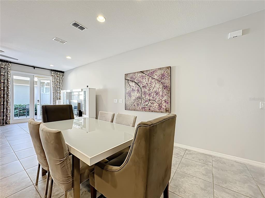 11209 Grander Drive Windermere, FL 34786 - Photo 10 of 35 a view of a dining room with furniture