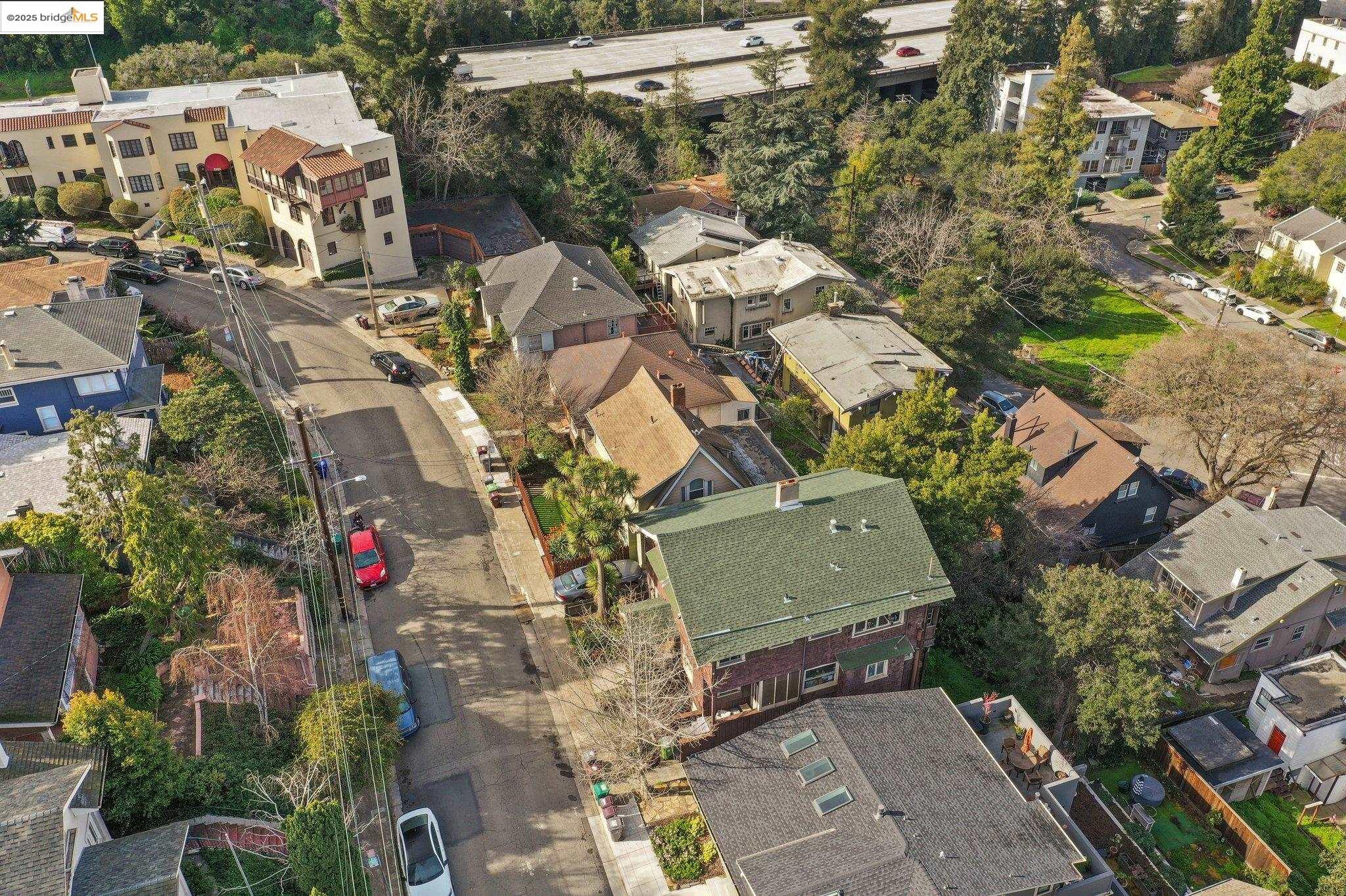 3537 Kempton Way Oakland, CA 94611 - Photo 11 of 17 an aerial view of a house with a yard and mountain view in back