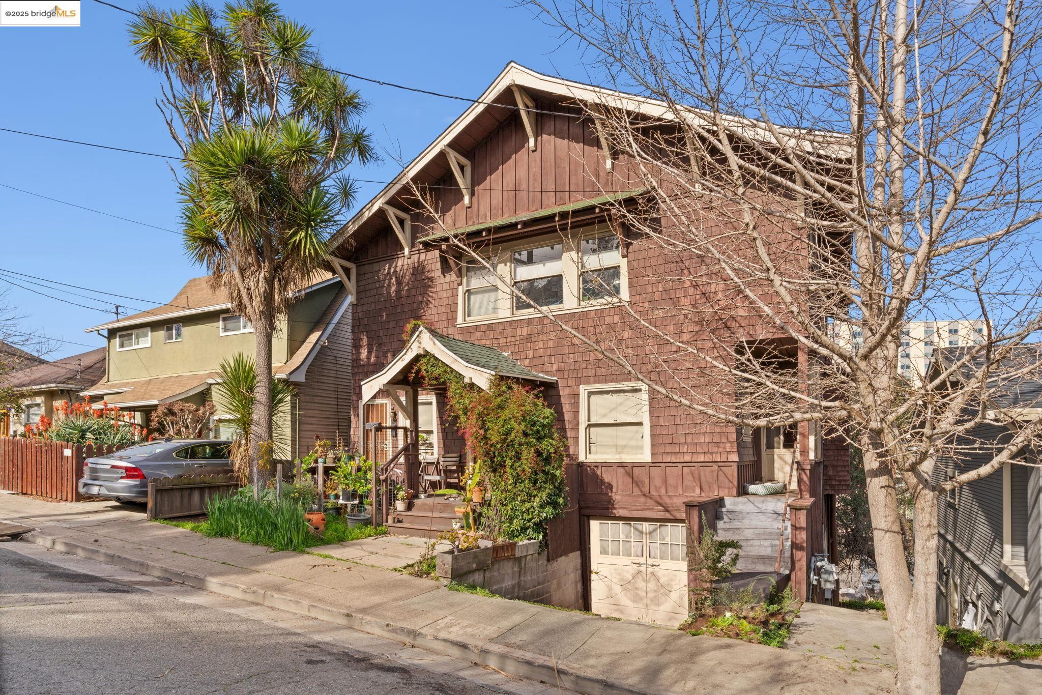 3537 Kempton Way Oakland, CA 94611 - Photo 3 of 17 a front view of a house with garden