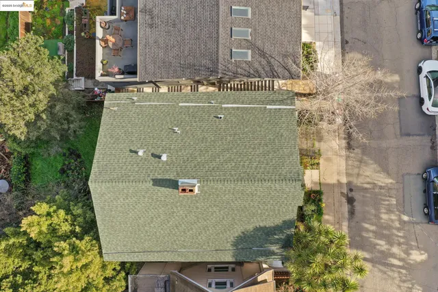 aerial view of a house with a yard
