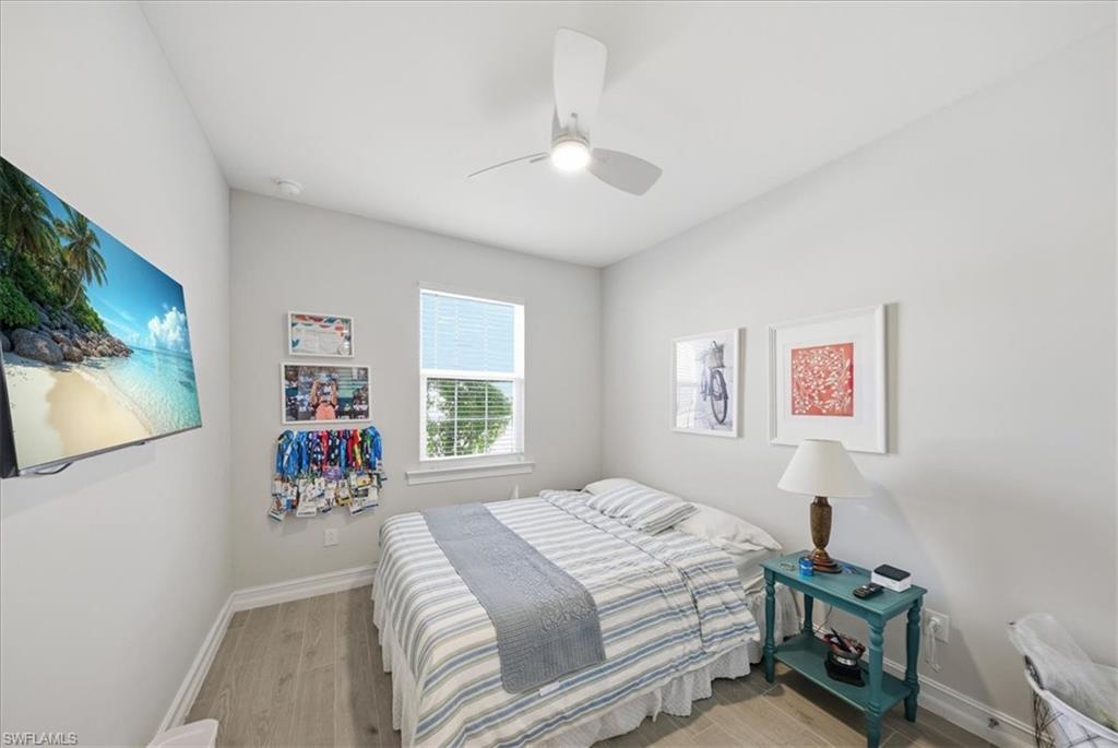 1074 Enbrook Loop Naples, FL 34114 - Photo 10 of 36 a bedroom with a bed and a window