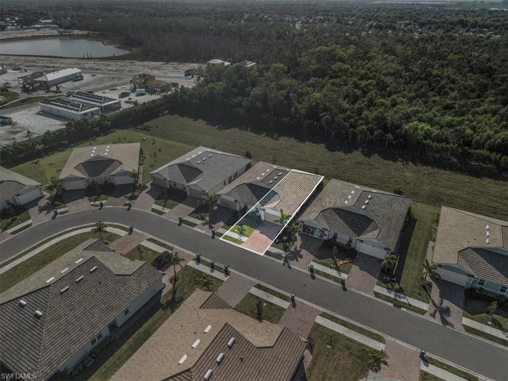 1074 Enbrook Loop Naples, FL 34114 - Photo 27 of 36 an aerial view of residential house with outdoor space