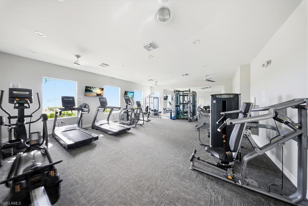 1074 Enbrook Loop Naples, FL 34114 - Photo 30 of 36 a view of a room with gym equipment