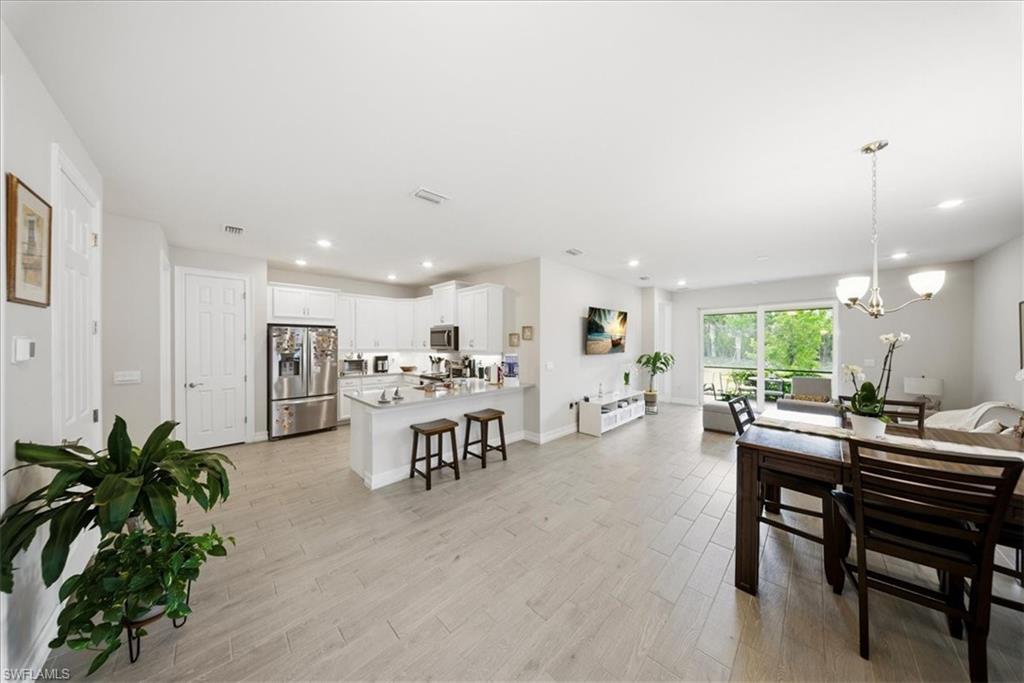 1074 Enbrook Loop Naples, FL 34114 - Photo 5 of 36 a view of a dining room with furniture