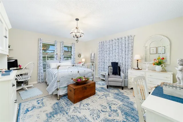 a bathroom with a granite countertop sink a toilet and a mirror