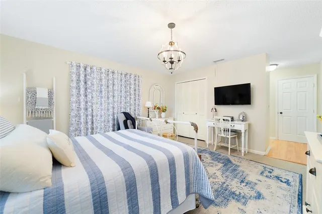 a bathroom with a sink a toilet a mirror a vanity and shower