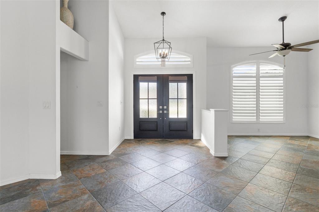 3456 Hanging Moss Loop Spring Hill, FL 34609 - Photo 15 of 81 wooden floor in an empty room with a window