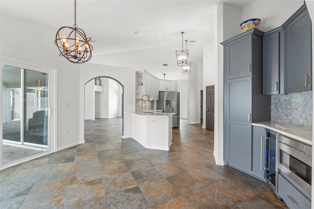3456 Hanging Moss Loop Spring Hill, FL 34609 - Photo 26 of 81 a view of entryway with kitchen