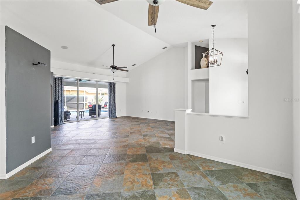 3456 Hanging Moss Loop Spring Hill, FL 34609 - Photo 29 of 81 a view of empty room with wooden floor and fan