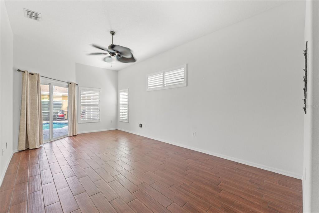 3456 Hanging Moss Loop Spring Hill, FL 34609 - Photo 33 of 81 a view of an empty room with glass door