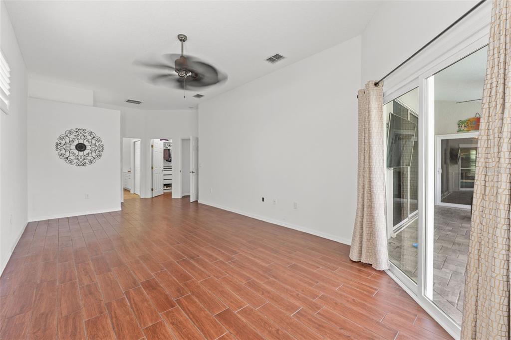 3456 Hanging Moss Loop Spring Hill, FL 34609 - Photo 34 of 81 a view of empty room with wooden floor