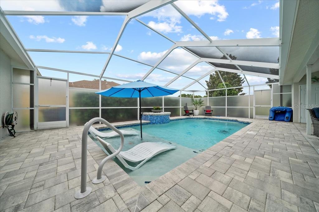3456 Hanging Moss Loop Spring Hill, FL 34609 - Photo 60 of 81 a view of a room with wooden floor and iron fence