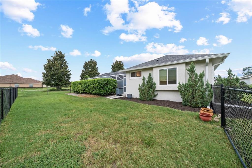 3456 Hanging Moss Loop Spring Hill, FL 34609 - Photo 68 of 81 a view of a house with backyard and garden